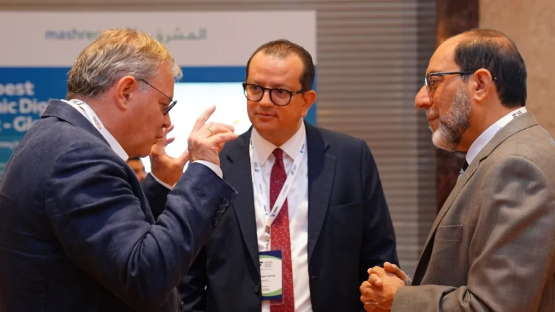 Three delegates in conversation
