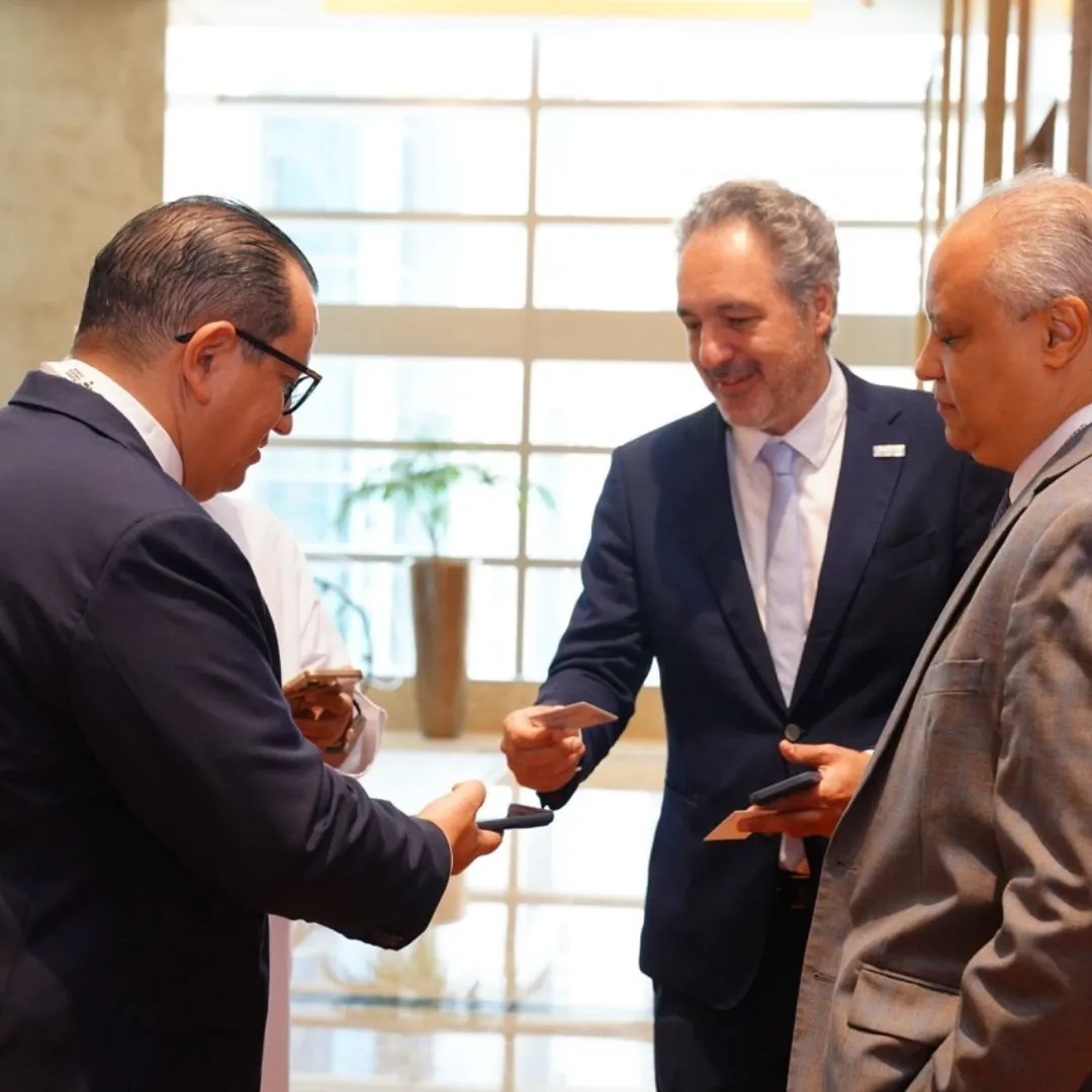 Delegates exchanging business cards between sessions